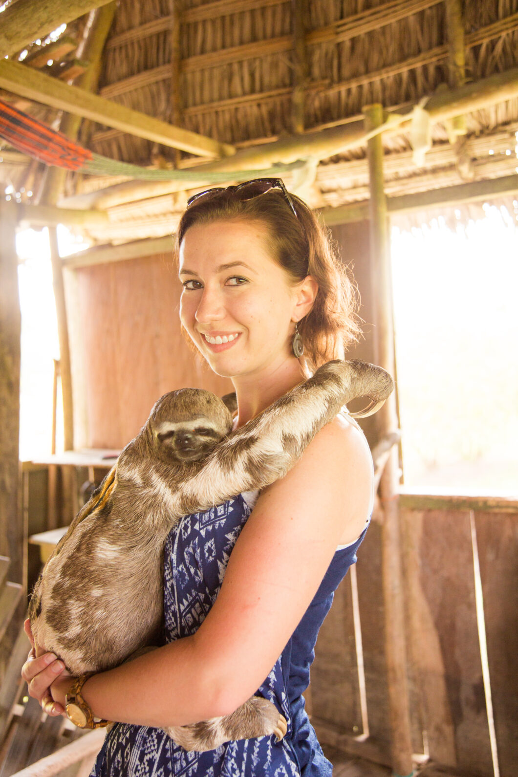 Me with a cute sloth while Visiting a Village in the Amazon