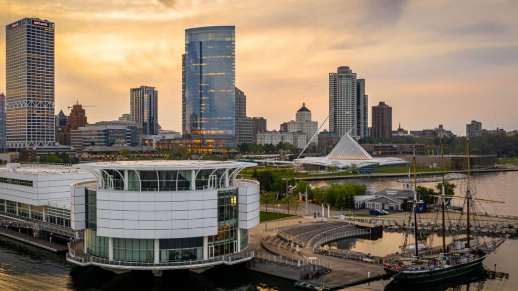 Milwaukee, WI / USA - June 04, 2019: Aerial view of Milwaukee, Wisconsin featuring the Discovery World, the Dennis Sullivan sailing vessel , Lakeshore Park and the Milwaukee Art Museum