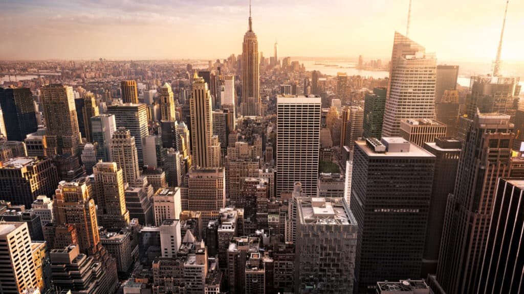 New York City skyline with urban skyscrapers at sunset, USA.