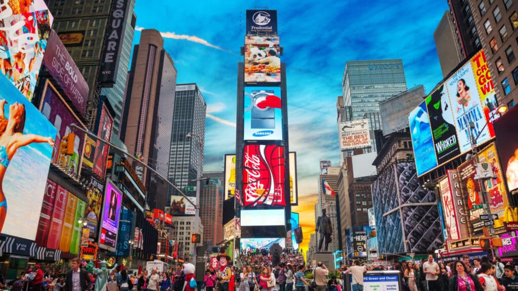 NEW YORK CITY - MAY 11: Times Square with tourists on May 11, 2013. Iconified as "The Crossroads of the World" it's the brightly illuminated hub of the Broadway Theater District.953