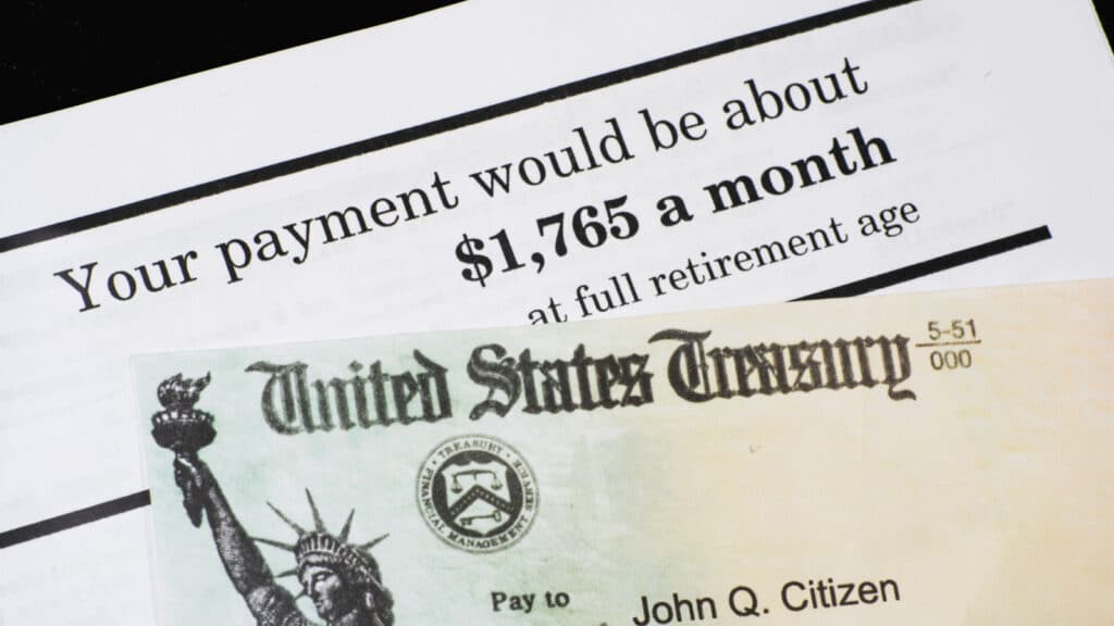 A Corner of Social Security Administration annual statement showing benefits amount at full retirement age with SSA check. Concept of retirement planning.