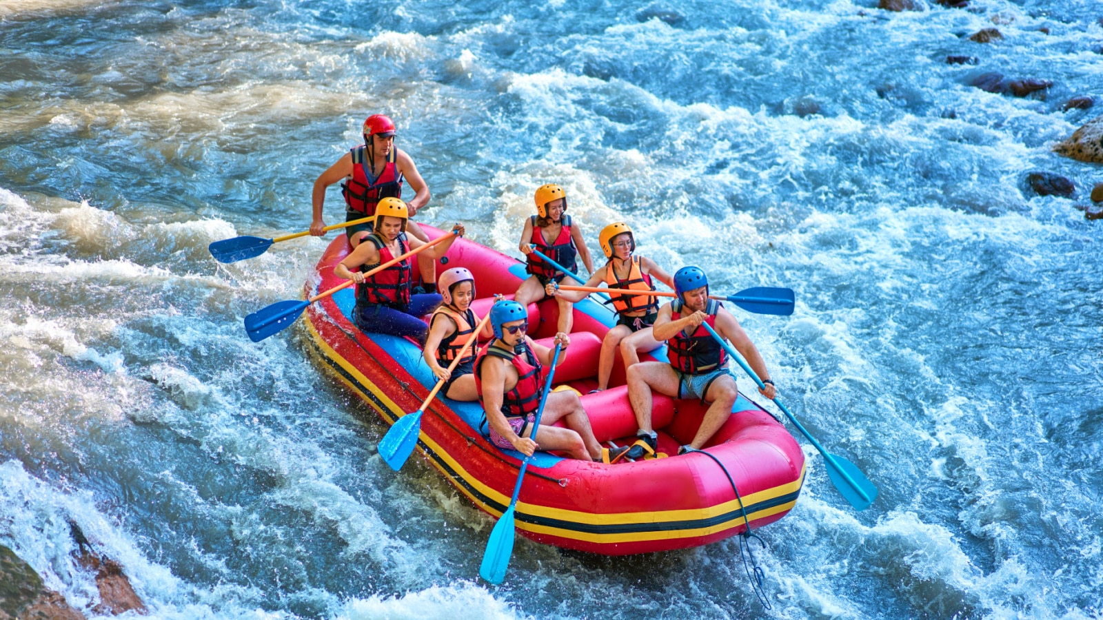 rafting on a large boat on a mountain river