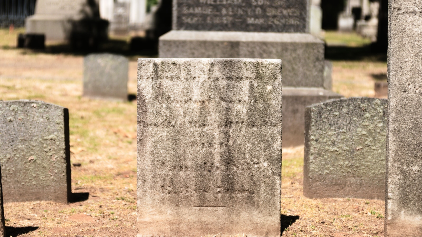 Photo of a very old, vintage, antique tombstone (headstone) at the historic Grove Street Cemetery, one of the oldest burial grounds in New Haven, Connecticut, USA.