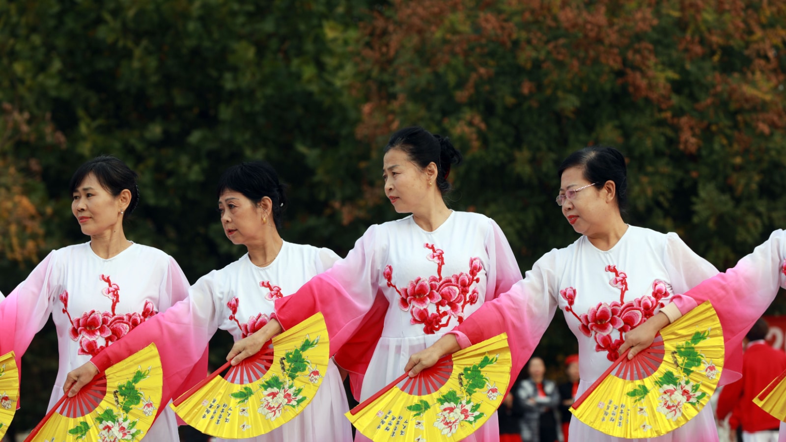 LUANNAN COUNTY, China - October 25, 2020: Elderly fitness dance shows celebrate the Double Ninth Festival on a park square, LUANNAN COUNTY, Hebei Province, China