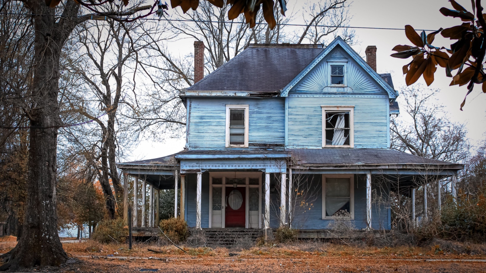 Greenville, Mississippi United States - January 2 2021: an old blue clapboard house on the corner