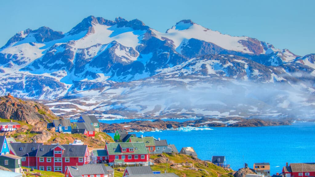 Picturesque village on coast of Greenland - Colorful houses in Tasiilaq, East Greenland