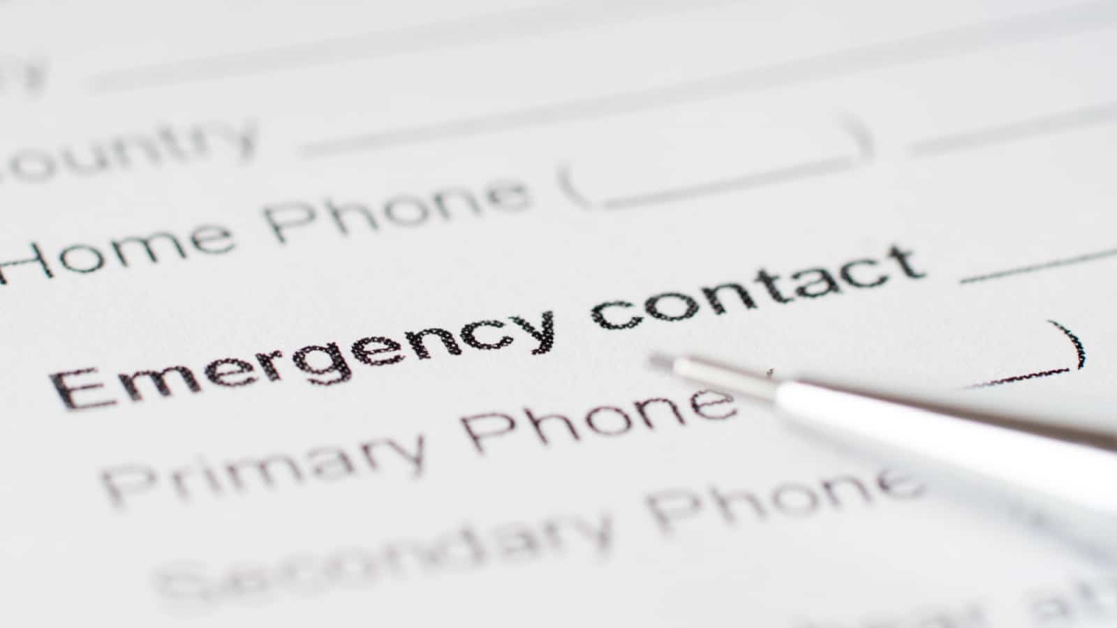 emergency contact paper sheet with phone number