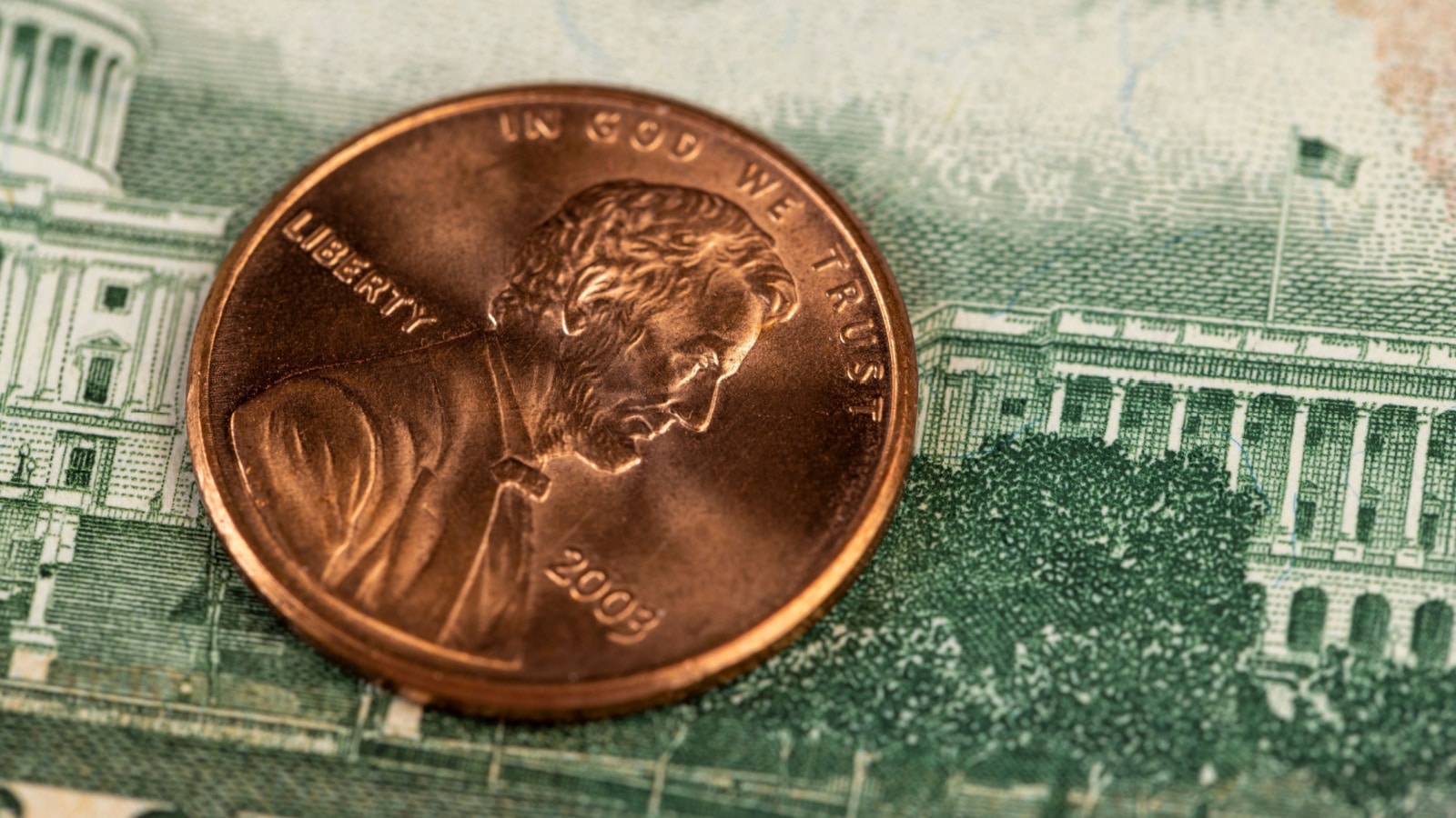 copper American coins with a face value of one cent , a close-up of old coins of 1 cent