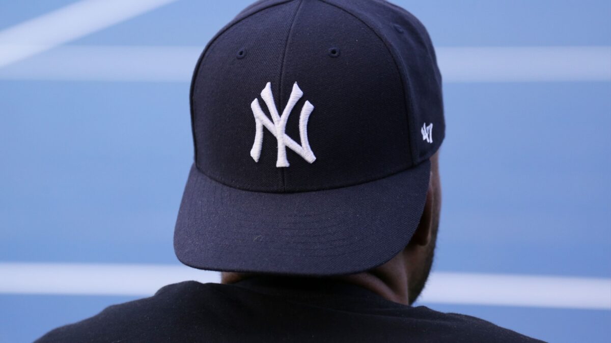 NEW YORK - AUGUST 29, 2015: Fan wears New York Yankees hat at Billie Jean King National Tennis Center in New York