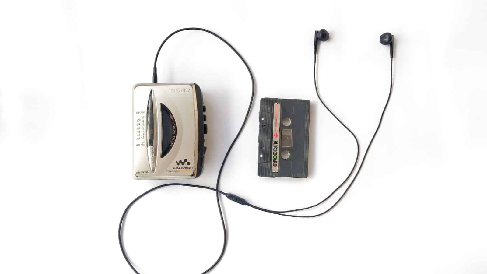 Klaten, Central Java Indonesia - April 28 2023: A vintage walkman, audio cassete, and earphones on the white background