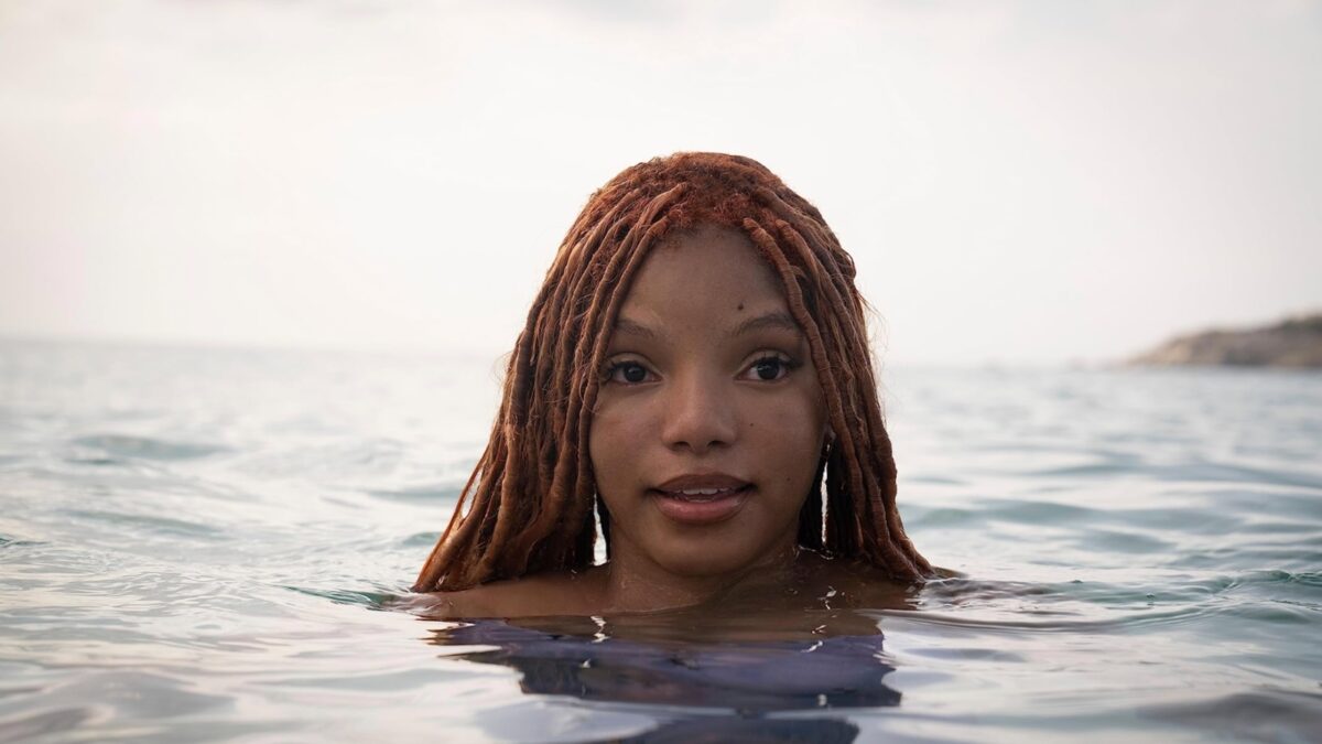 Woman's head with her body submerged in the ocean.