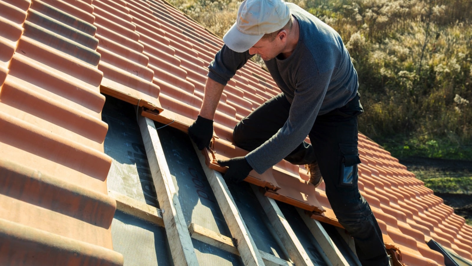 Man fixing roof