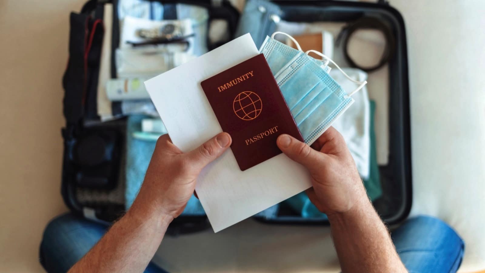 Traveler packing his passport