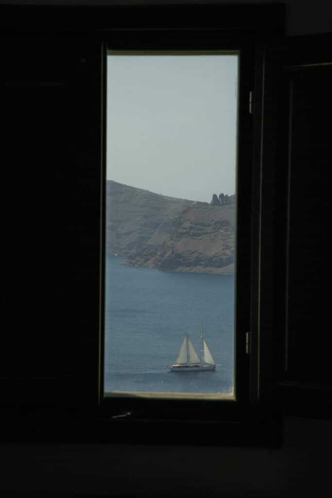A sailboat on the water The view from our bedroom window at the IKIES.