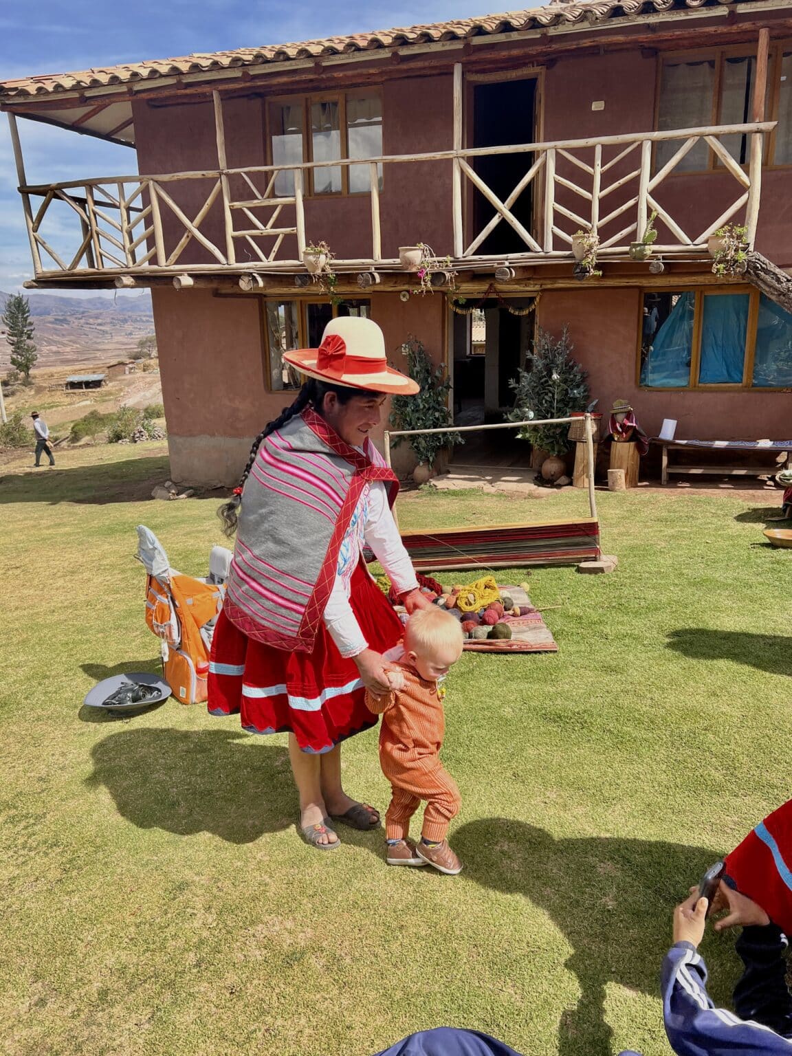 A woman dancing with a baby in Peru