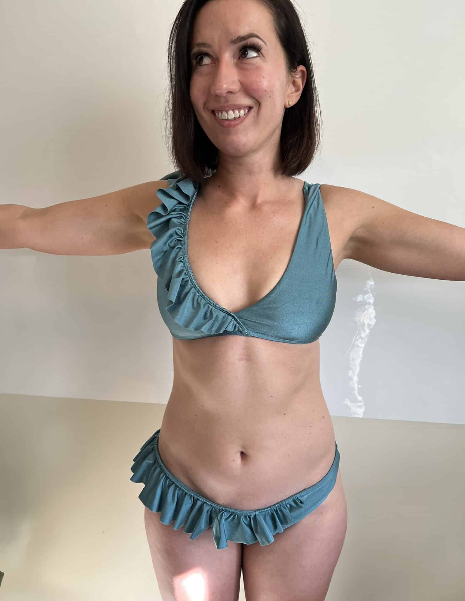 Lindsey in a swimsuit after laser hair removal treatment