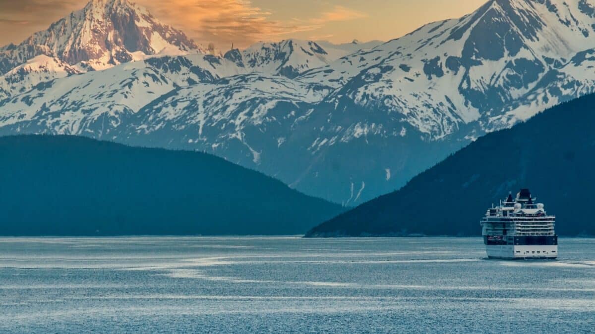 Cruise Ship sailing on the inside passage near Skagway near the Alaskan mountain range.