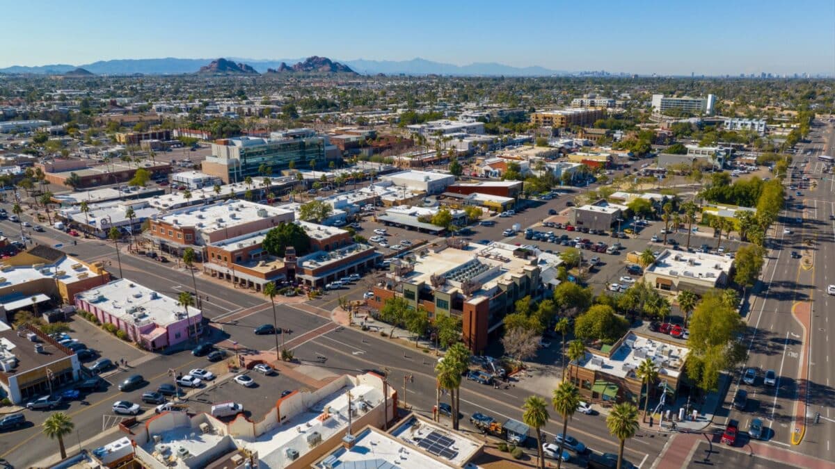 Scottsdale city center aerial view on Scottsdale Road at Indian School Road at the background in city of Scottsdale, Arizona AZ, USA.