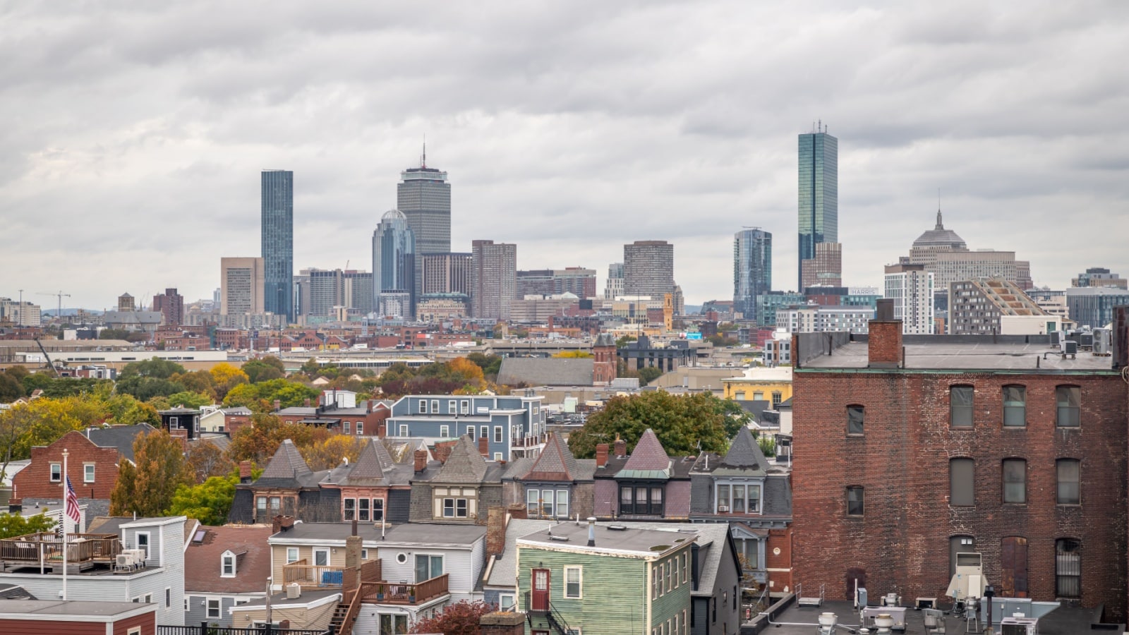 BOSTON, MA - 20 OCTOBER 2023: The Boston skyline seen from a rooftop of a condo building south of downtown