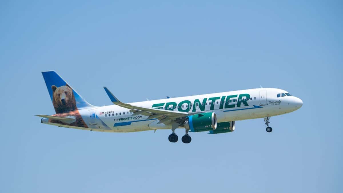 IRVING, USA - May 26, 2024: Frontier Airlines aircraft Airbus A320-251N approaching the Dallas Fort Worth International Airport (DFW), blue skies.