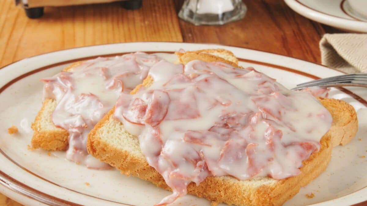 Creamed chipped beef on toast with a cup of coffee