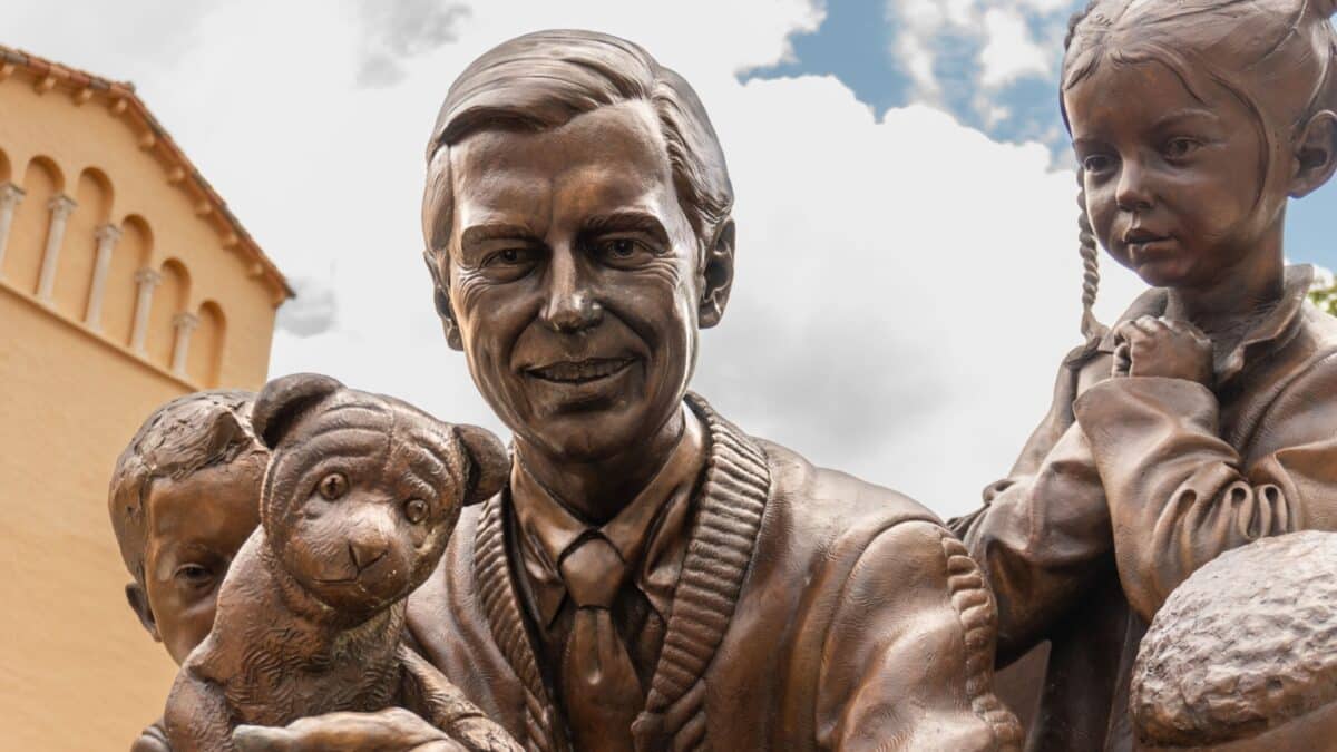 Winter Park, Florida -2022: Fred McFeely Rogers “A Beautiful Day for a Neighbor” 360-degree outdoor sculpture at Rollins College by British sculptor Paul Day. Mr Rogers with Daniel Tiger and children.