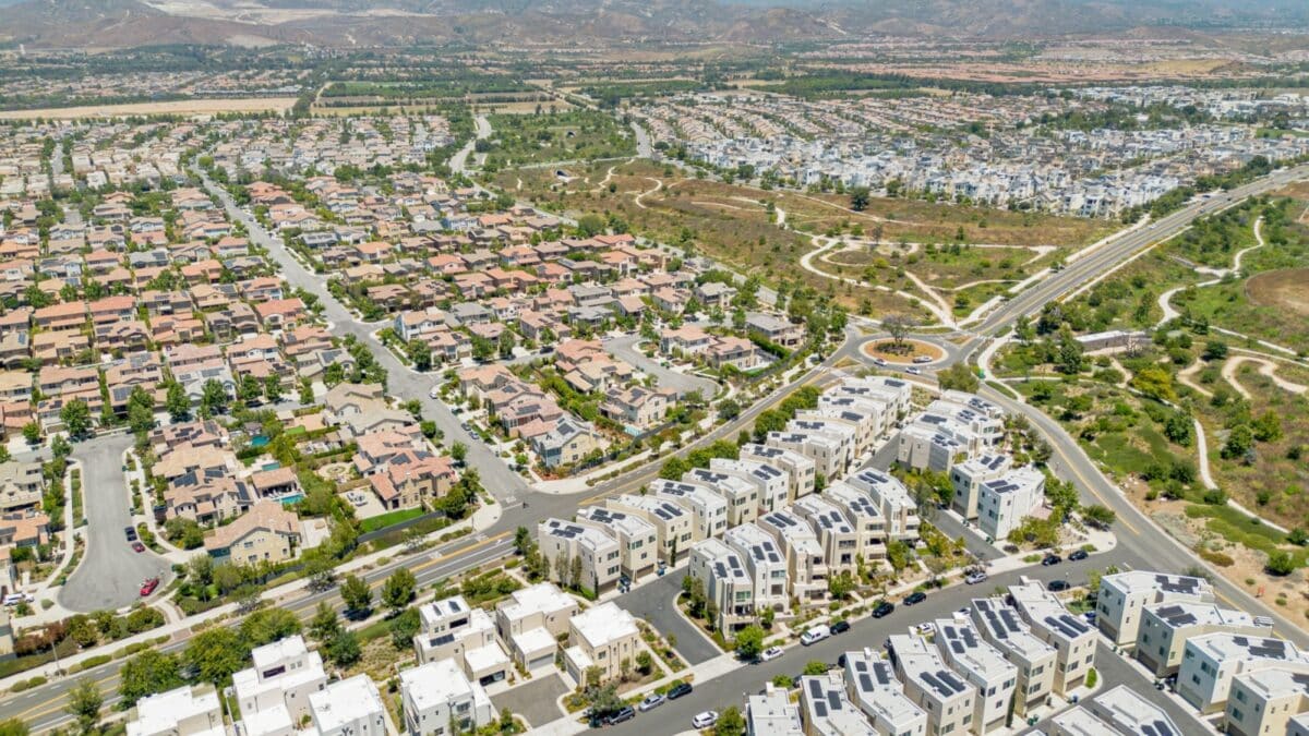 Irvine, California - July 1, 2023: Aerial drone photo above Irvine Great Park Village in Irvine for new townhouses, townhomes, homes, houses, with Great Park Blvd, Parasol Park, Single Dogs Trail, Bea