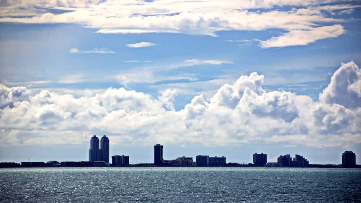 City of Brownsville,Tx,USA.27,June, 2018. Panoramic views of the coast of the in the daytime and evening in the red rays of sunset. Observation from the side of the vessel standing in the roadstead.