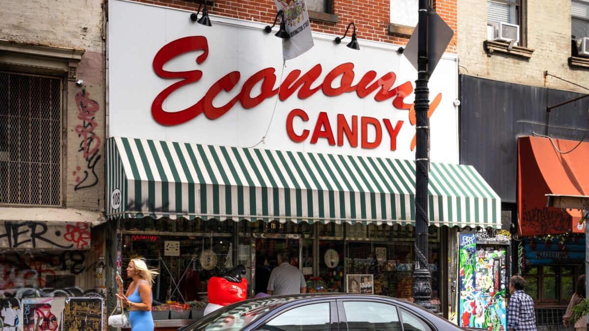 New York, NY - US - Sept 16, 2023 Shoppers in front of the family-owned business Economy Candy, the oldest candy store in New York City. Located on on Rivington Street in Manhattan’s Lower East Side.