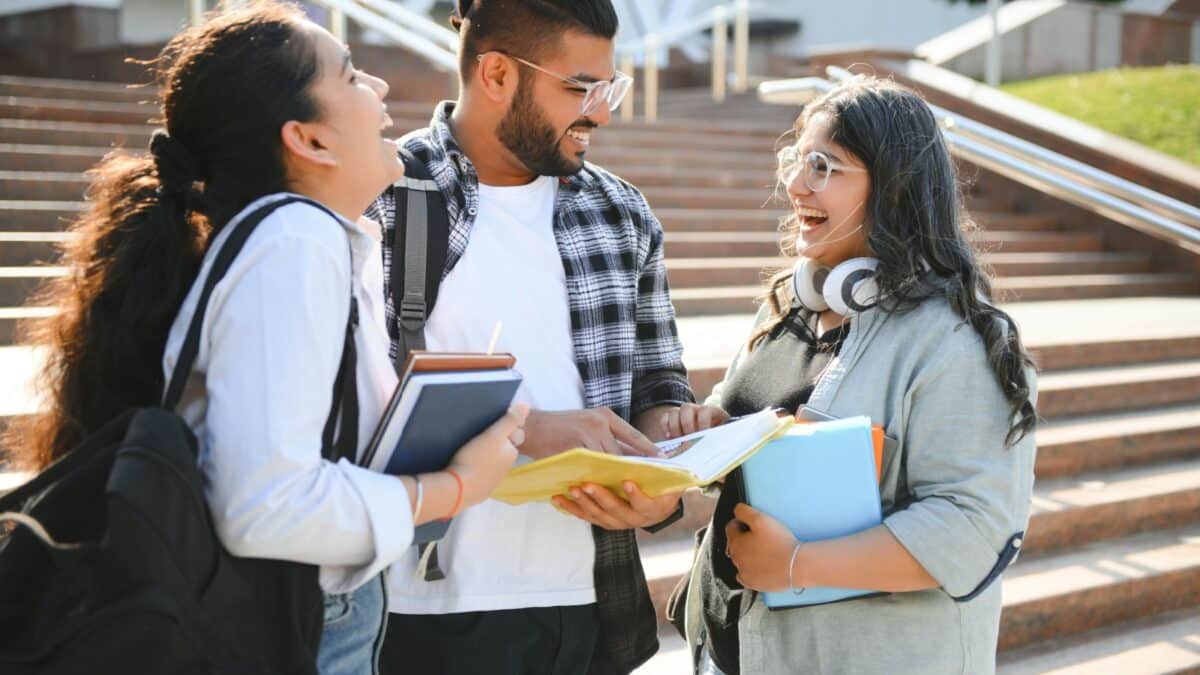 Cheerful Indian asian young group of college students or friends together.