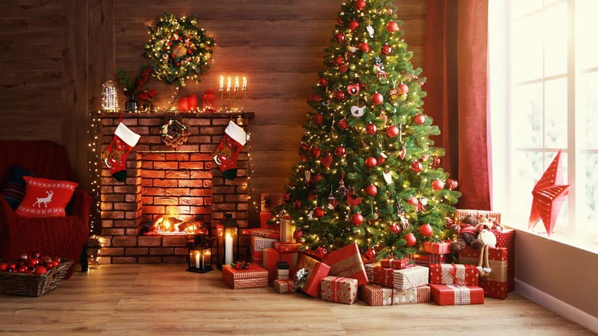 interior christmas. magic glowing tree, fireplace and gifts