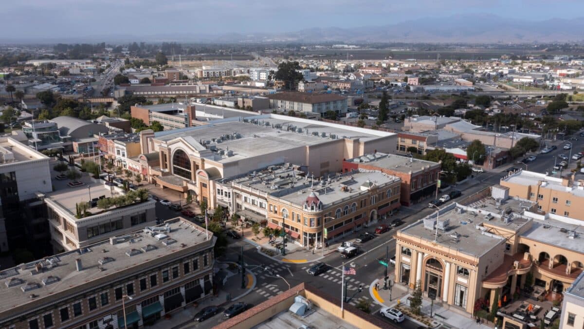 During a break in the fog, afternoon sunlight shines on the historic city center of downtown Salinas, California, USA.