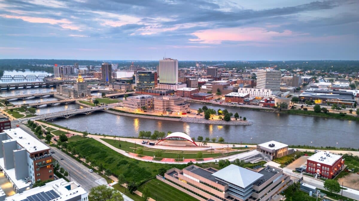 Cedar Rapids, Iowa, USA cityscape on the Cedar River at dusk.