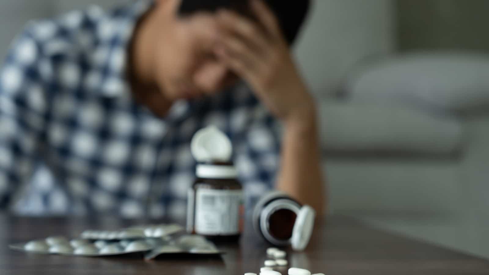 asian man use pills overdose, stressed, sad, drug abuser, drug addict, sick, unhealthy, unhappy, suicide, depressed or hopeless, Anti drug, drug addict, life and family problems, unmotivated