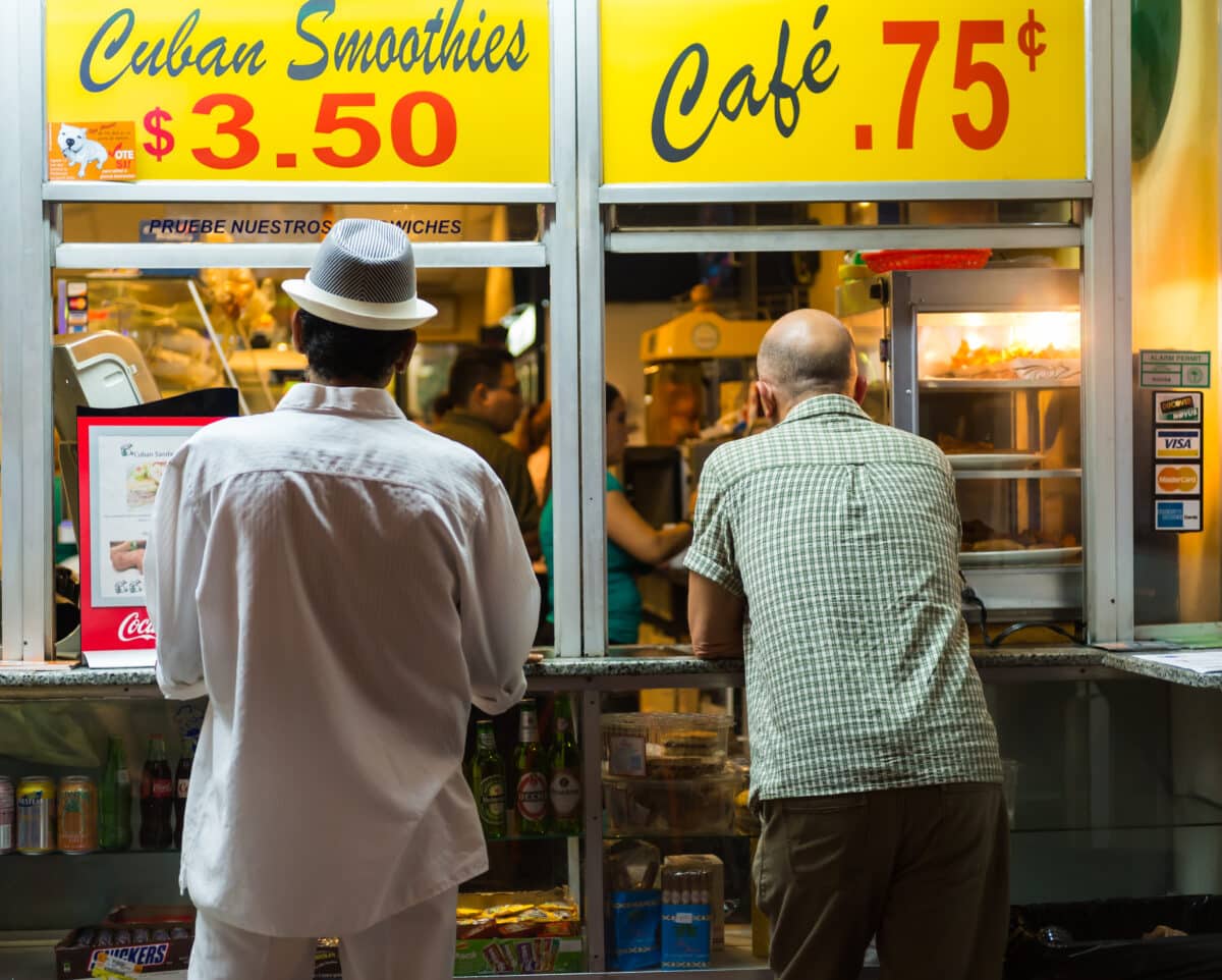 MIAMI, FL - CIRCA JULY 2012: Typical Coffee Shop window in Little Havana circa July 2012 in Miami, during "cultural fridays" an artistic, cultural, and social fair that takes place monthly.